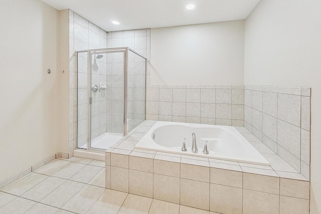 bathroom featuring tile patterned flooring and shower with separate bathtub