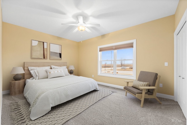 bedroom featuring carpet, ceiling fan, and a closet