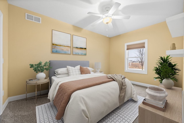 bedroom featuring ceiling fan and carpet