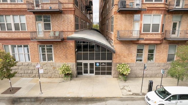 view of building exterior featuring a garage and driveway