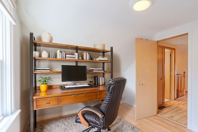 home office with light wood-type flooring