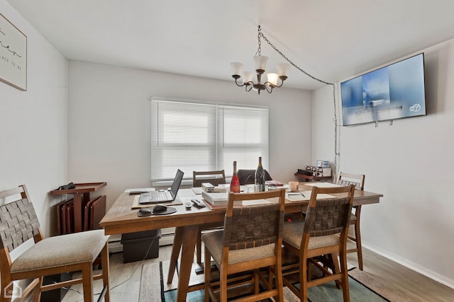 dining room featuring a notable chandelier and hardwood / wood-style floors