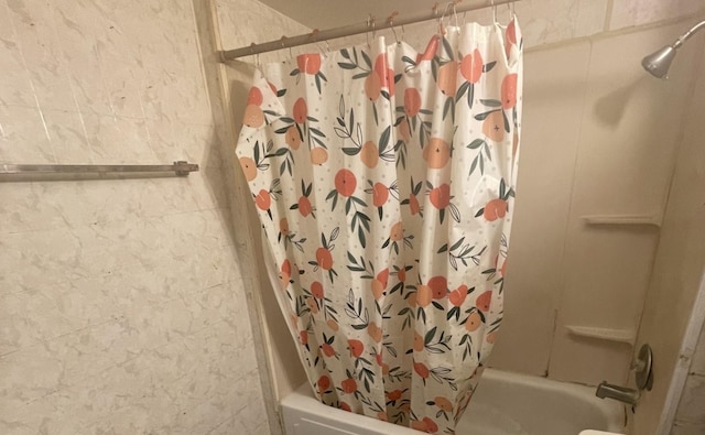 bathroom with shower / bath combination with curtain