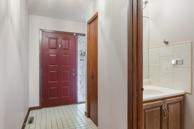 interior space featuring tile patterned flooring and vanity