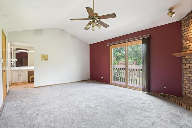 unfurnished living room with lofted ceiling, light colored carpet, and ceiling fan