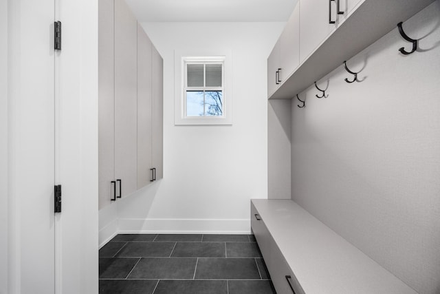 mudroom featuring dark tile patterned flooring