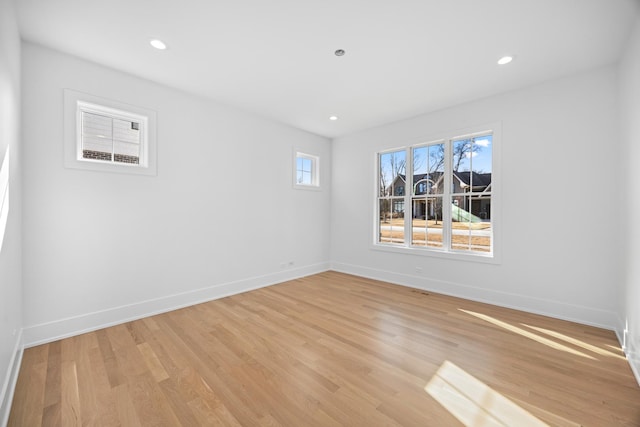 spare room featuring light hardwood / wood-style floors