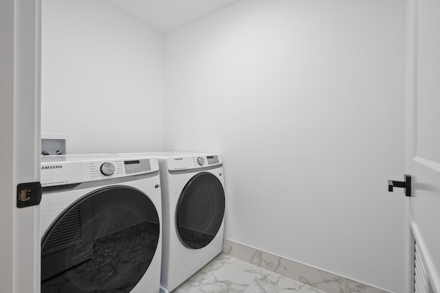 laundry room featuring independent washer and dryer