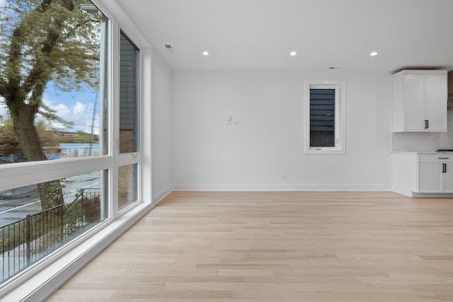 unfurnished living room featuring light wood-type flooring