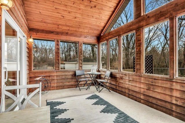 unfurnished sunroom with lofted ceiling and wooden ceiling