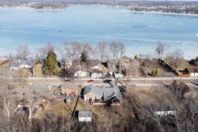 birds eye view of property featuring a residential view and a water view