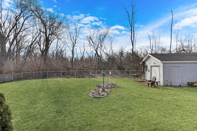 view of yard featuring an outbuilding and a fenced backyard