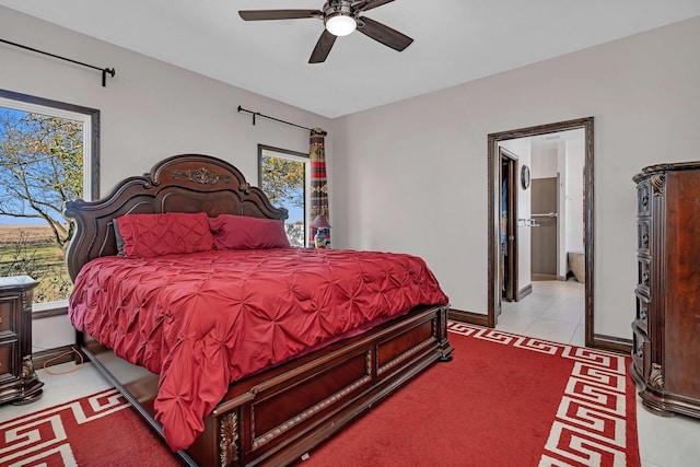 tiled bedroom with ceiling fan