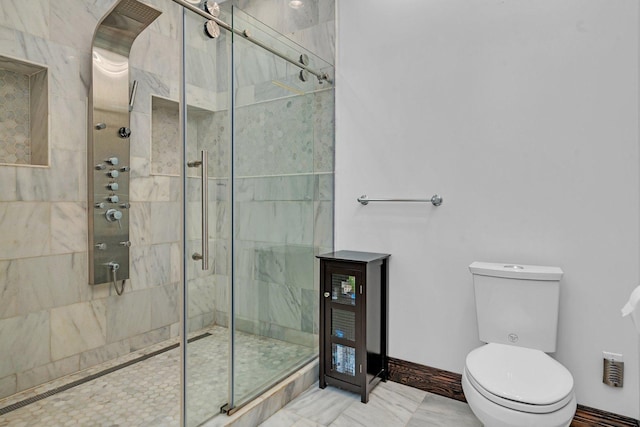 bathroom with tiled shower and toilet