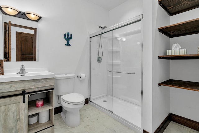 bathroom featuring vanity, an enclosed shower, and toilet