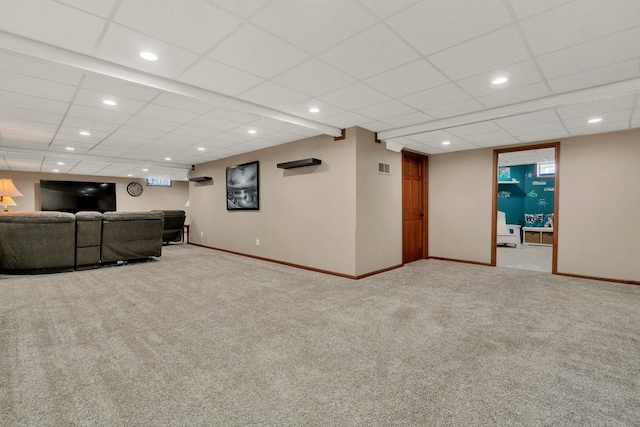 unfurnished living room featuring a paneled ceiling and carpet flooring