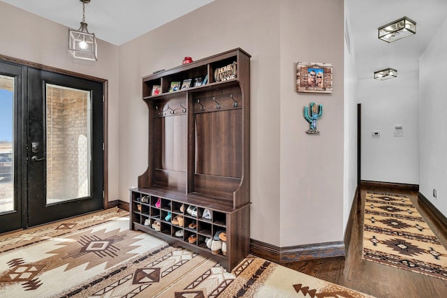 mudroom with wood-type flooring