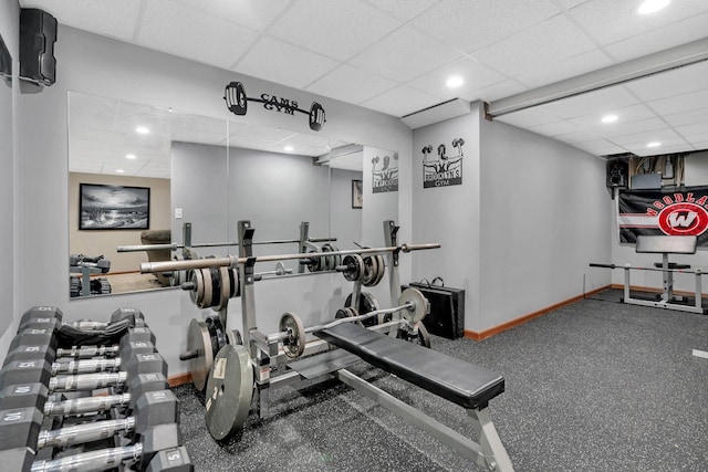 exercise area featuring a paneled ceiling