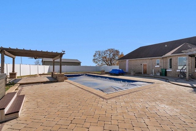 view of swimming pool featuring a patio area and a pergola