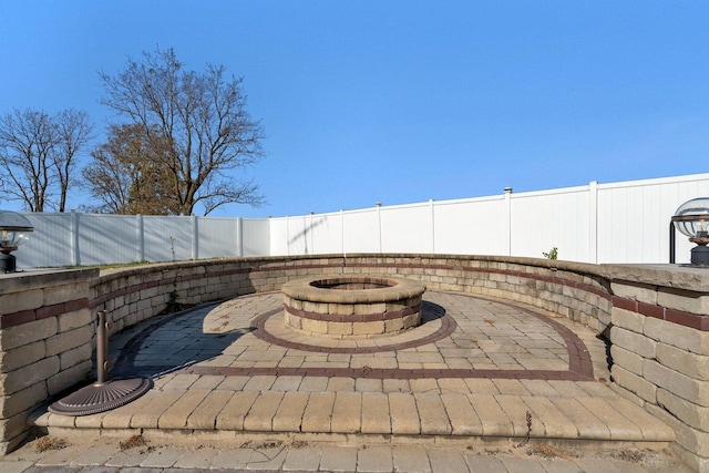 view of patio featuring an outdoor fire pit