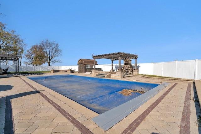 view of pool featuring a pergola and a patio area