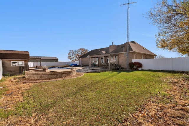 view of yard with a fenced in pool, a pergola, and a storage shed