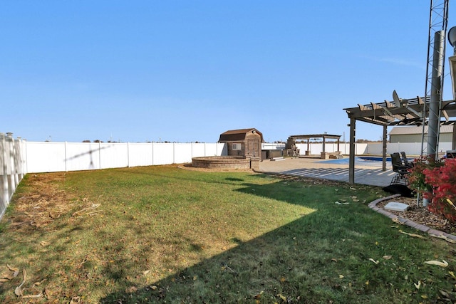 view of yard featuring a storage shed, a patio area, and a pergola