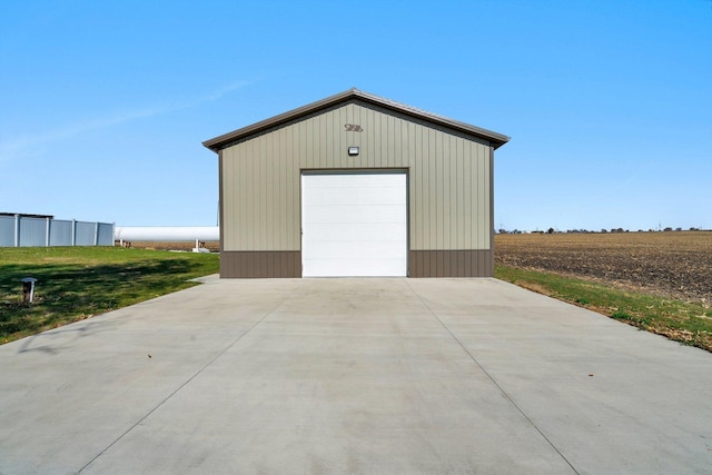 garage featuring a rural view