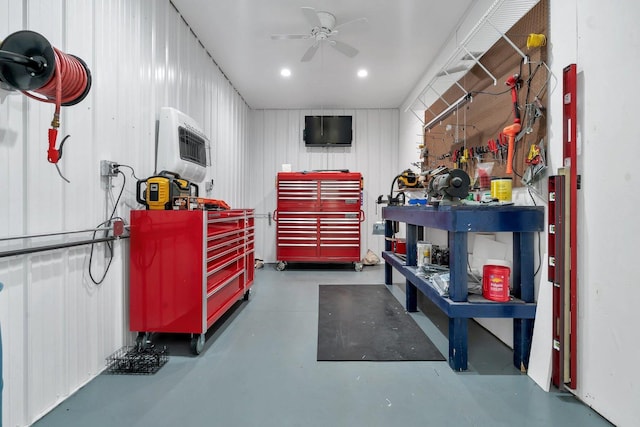 garage with ceiling fan and a workshop area