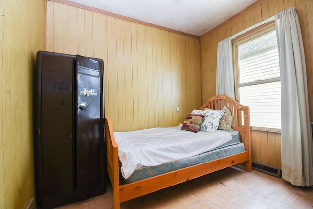 bedroom featuring wooden walls