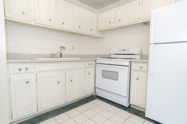 kitchen with sink, backsplash, white cabinets, light tile patterned floors, and white appliances