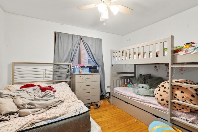 bedroom with ceiling fan and light hardwood / wood-style flooring