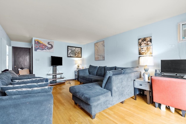 living room with light hardwood / wood-style flooring