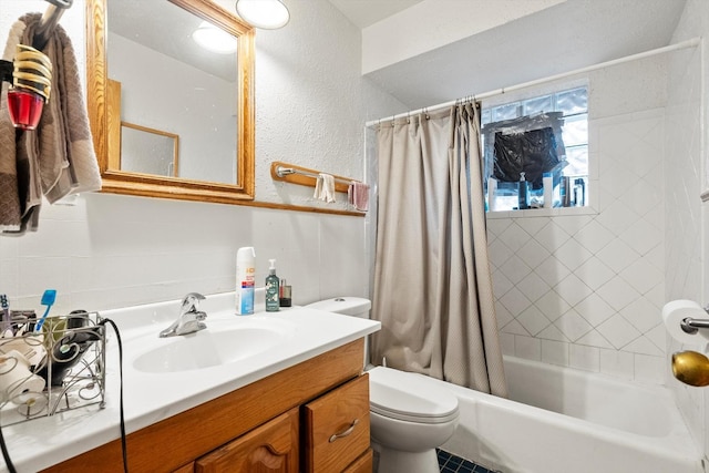 full bathroom featuring vanity, shower / bath combo, and toilet