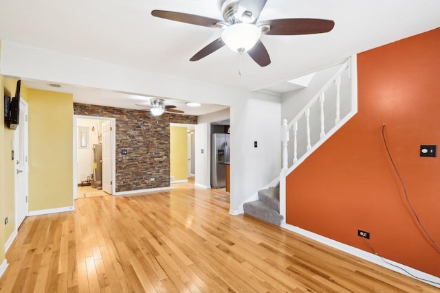 unfurnished living room with light hardwood / wood-style flooring