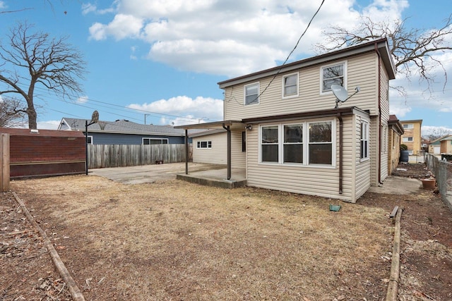 back of property featuring a patio