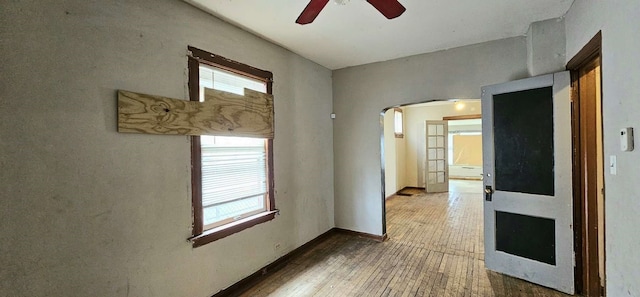 unfurnished room featuring hardwood / wood-style floors and ceiling fan