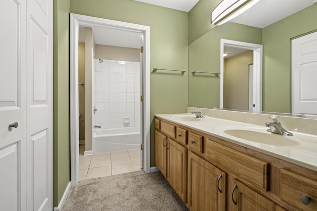 bathroom featuring tile patterned floors, vanity, and tiled shower / bath