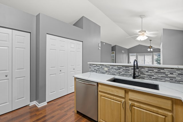 kitchen featuring sink, tasteful backsplash, vaulted ceiling, dark hardwood / wood-style flooring, and dishwasher