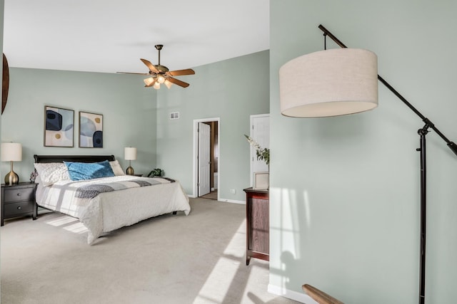 bedroom featuring light carpet, high vaulted ceiling, and ceiling fan