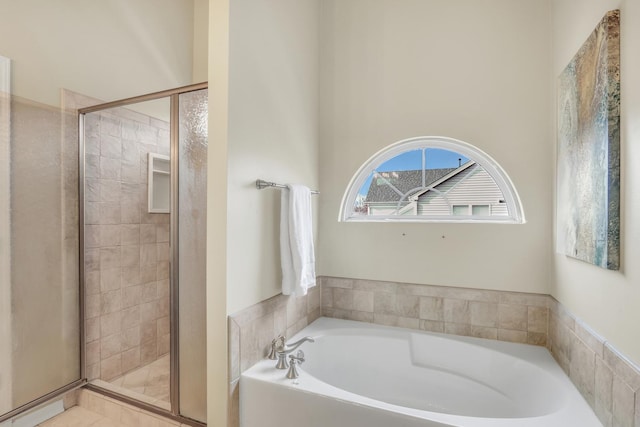 bathroom with shower with separate bathtub