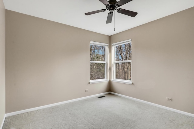 carpeted empty room with ceiling fan