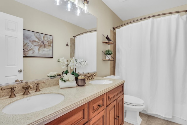 bathroom with vanity, tile patterned floors, and toilet