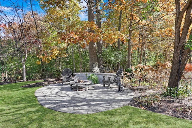 view of yard with a fire pit and a patio area