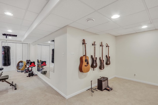 exercise area featuring a drop ceiling and carpet