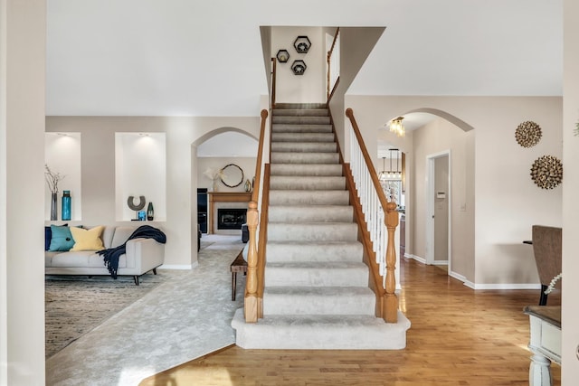 stairs featuring hardwood / wood-style flooring