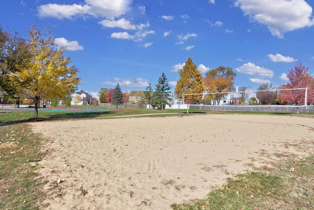 view of home's community featuring volleyball court