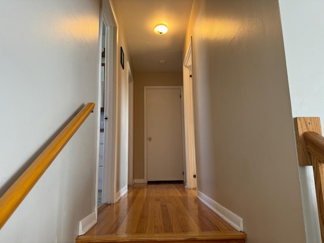 hallway with light wood-type flooring