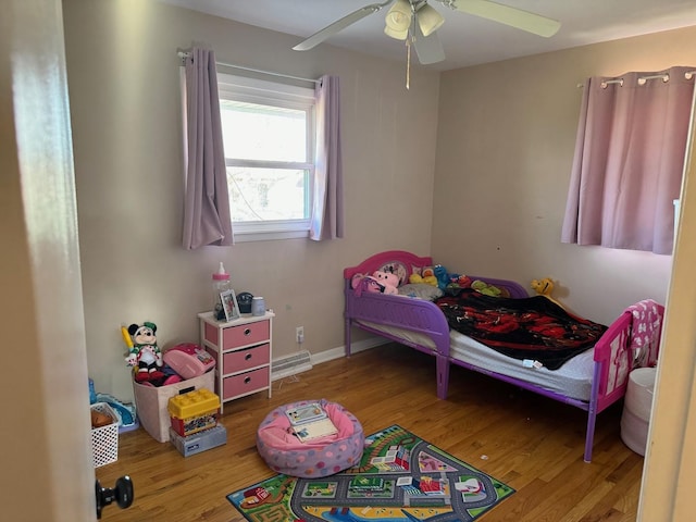 bedroom featuring ceiling fan and hardwood / wood-style floors