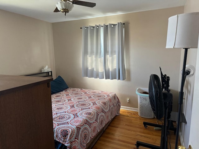 bedroom featuring wood-type flooring and ceiling fan